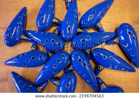 A bunch of blue ocarinas