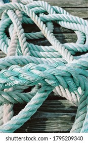 A Bunch Of Blue-green Rope Lies On A Quay In The Harbor Of Bogense On The Danish Island Of Funen