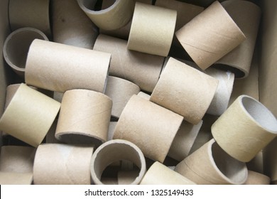 A bunch of brown industrial paper core isolated on white background with shadow reflection. A lot of paper cores or paper tubes on white backdrop. Brown paper rolls. - Image 