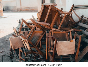 A Bunch Of Chairs Abandoned In The Street