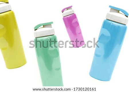 Bunch of colorful fancy tin tumbler bottle isolated on white
