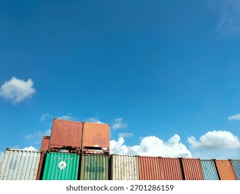 a bunch of containers in the clear sky