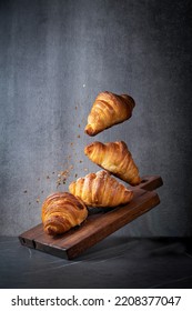 bunch of croissants are flying