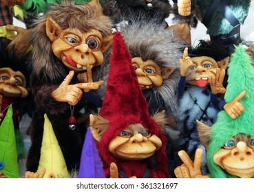 A bunch of different colorful little cute trolls
