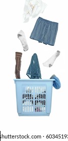 A Bunch Of Dirty Laundry Clothes Fly Out Of The Laundry Basket. Cutout Isolated On White Background.