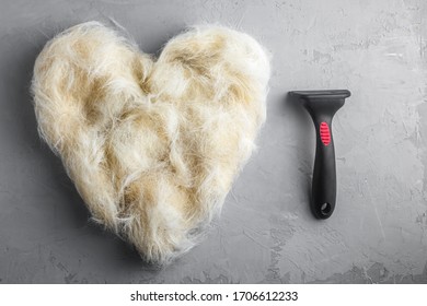 Bunch Of Dog Hair After Grooming In Shape Of Heart. Spring Molt.