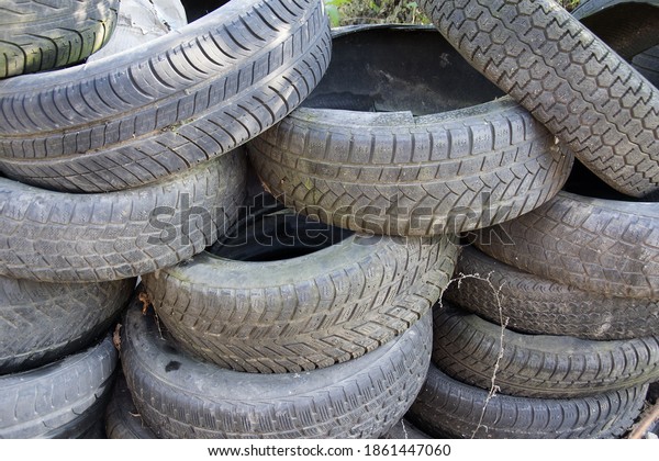 A bunch of dump tires from used cars.\
Environmental pollution. Old\
tires.