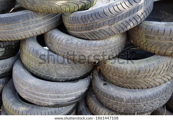 A bunch of dump tires from used cars.\
Environmental pollution. Old\
tires.
