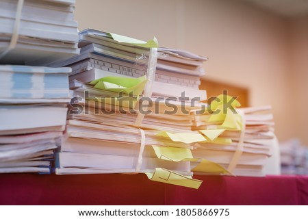 Bunch of education documents or report teacher after approve and checking from admistrator, Annual Reports document for evaluation in student study in university office
