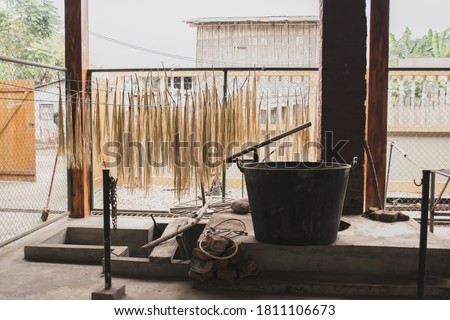 A bunch of farming tools and objects in an outdoor shed