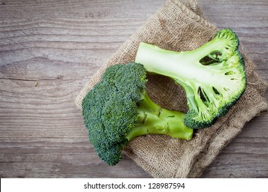 Bunch Of Fresh Green Broccoli On Wooden Background