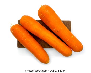 A Bunch Of Fresh Raw Carrots On A Wooden Stool (top View - Horizontal).