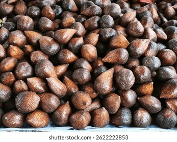 A bunch of fresh snake fruit sold at a roadside fruit shop