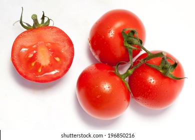 Bunch Of Fresh Tomatoes With Water Drops. Isolated On White Background. Top View.