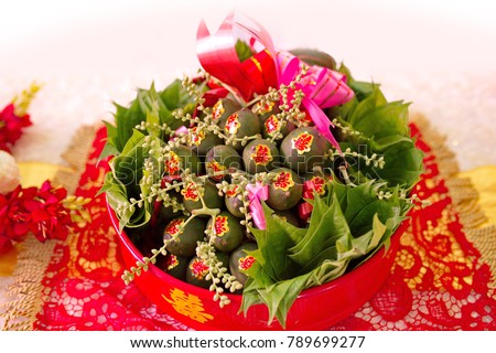Bunch of green palm and betel leafs on red tray - Wedding gifts to the bride family on Vietnam traditional wedding ceremony