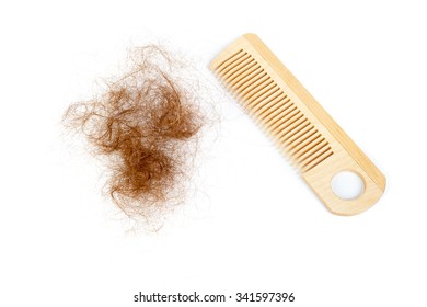Bunch of hair and the comb. Hair loss concept