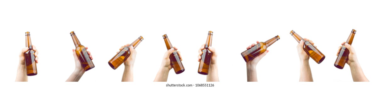 Bunch Of Hands Holding Bottles Of Beer Up At Party Giving A Cheers Isolated On White Background