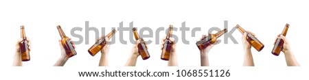 Bunch Of Hands Holding Bottles Of Beer Up At Party Giving A Cheers Isolated On White Background