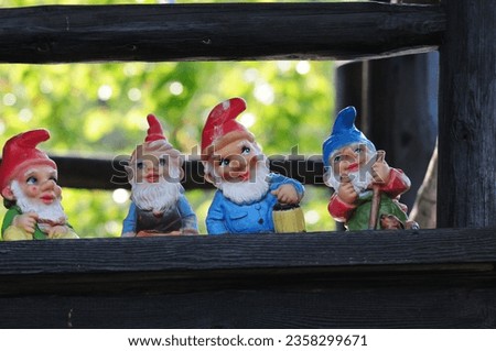 A bunch of happy garden gnomes, Four garden gnomes