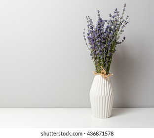 Bunch of lavender in a vase on a white table - Shutterstock ID 436871578