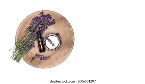 Bunch Of Lavenders, Lavender Oil And Face Cream On Wooden Plate, Isolated On White Background. Handmade Cosmetics. Overhead Shot With Copy Space.