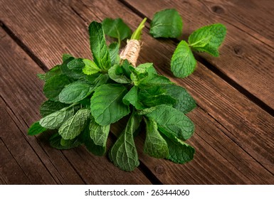 Bunch Of Mint On The Wooden Background