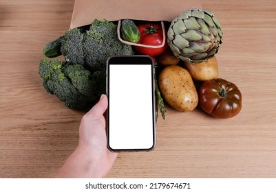 Bunch Of Mixed Vegetables, Herbs And Greens In A Brown Paper Bag. Vegan Diet Products. Clean Eating Concept. Eco Friendly Bag Full Of Groceries. Close Up, Copy Space, Background, Top View, Overhead