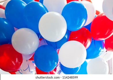 bunch of multi-colored balloons