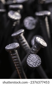 A bunch of nails on the table. Background with steel nails.