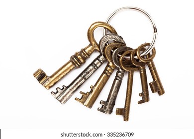Bunch of old keys isolated on white background