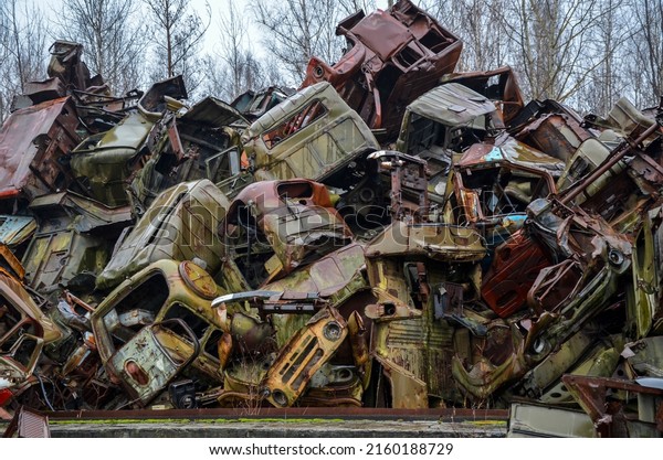 Bunch of old soviet wrecked trucks at the  to scrap\
metal recycling yard