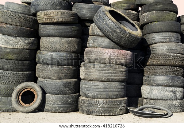A bunch of old\
tires ready for recycling