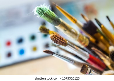 A bunch of paint brushes in different sizes. Close up.