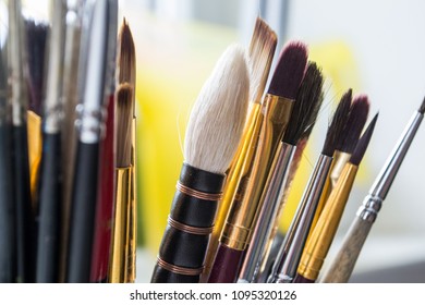 A bunch of paint brushes in different sizes. Close up.