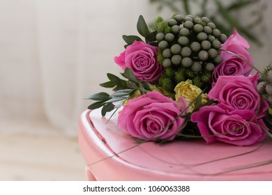 Bunch Of Pink Roses Lying On Pink Shabby Chic Style Wooden Chair Decorated With Decoupage Technique. Beautiful Flowers For A Romantic Evening, Close Up