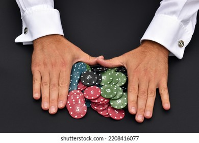 A Bunch Of Poker Chips And Male Hands Pushing Them On Black Background. Investment Concept. Gambling Concept. All In. Copy Space.