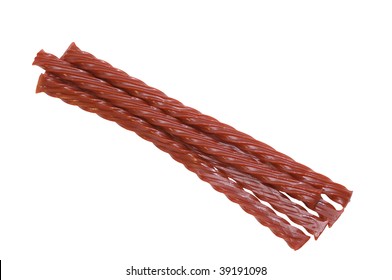 Bunch of red strawberry/cherry licorice candy against white background