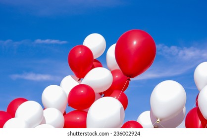 Bunch Of Red And White Balloons On A Blue Sky