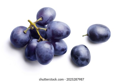 Bunch of ripe dark blue grapes Isolated on white background top view.