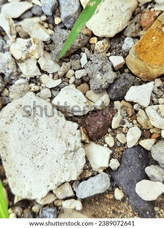 A bunch of river stones in the yard of the house. This collection of stones gives a beautiful and interesting color image. Everyone will feel calm and comfortable when they feel calm and comfortable