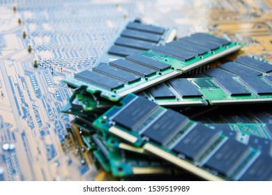 A Bunch Of Slats Of Memory Modules. Ddr And Sdram Storage. Computer Technology Texture. Random Access Memory On The Background Of The Motherboard. Selective Focus.