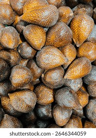 a bunch of snakefruit's (Salacca zalacca or salak) on a supermarket shelf