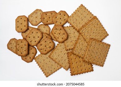 Bunch of spicy whole wheat and rye crackers. Isolated. Top view, flatlay.