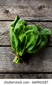 A Bunch Of Spinach On A Wooden Background