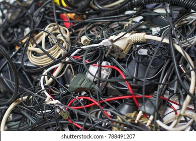 A Bunch Of Tangled Wires, Connectors And Cables