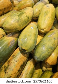 a bunch of tasty ripe papayas 