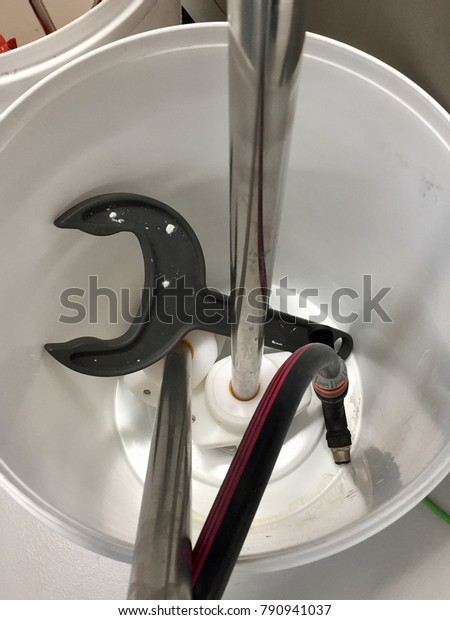 A bunch of tools in a\
bucket