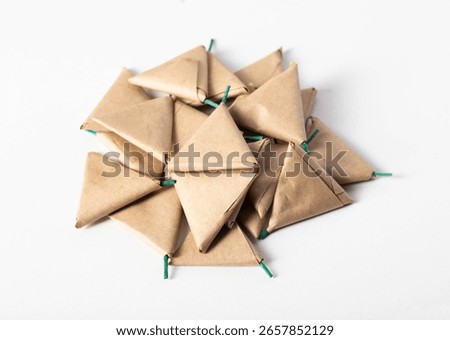 A bunch of triangle firecrackers on the table. The danger of pyrotechnics