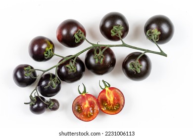 Bunch of Yoom Tomatoes with a slice in half on a white round background. - Shutterstock ID 2231006113