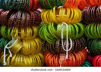 Bunches Of Indian Glass Bangles In Bright Colors Being Sold Along Open Street In Udaipur, Rajasthan, India.